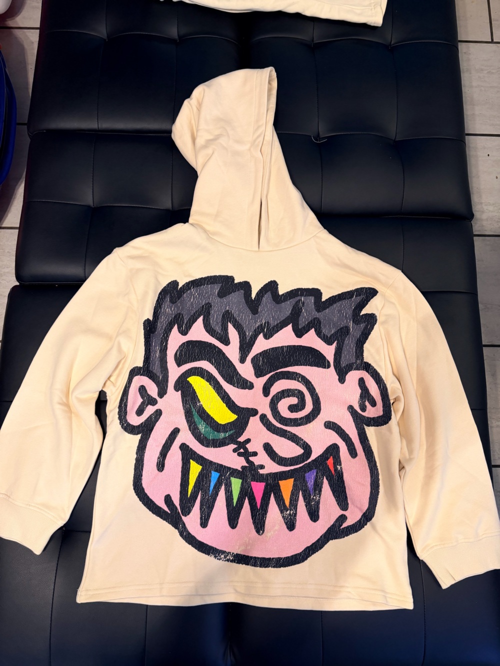 Men’s S Cream Hoodie with Colorful Monster Face Graphic
